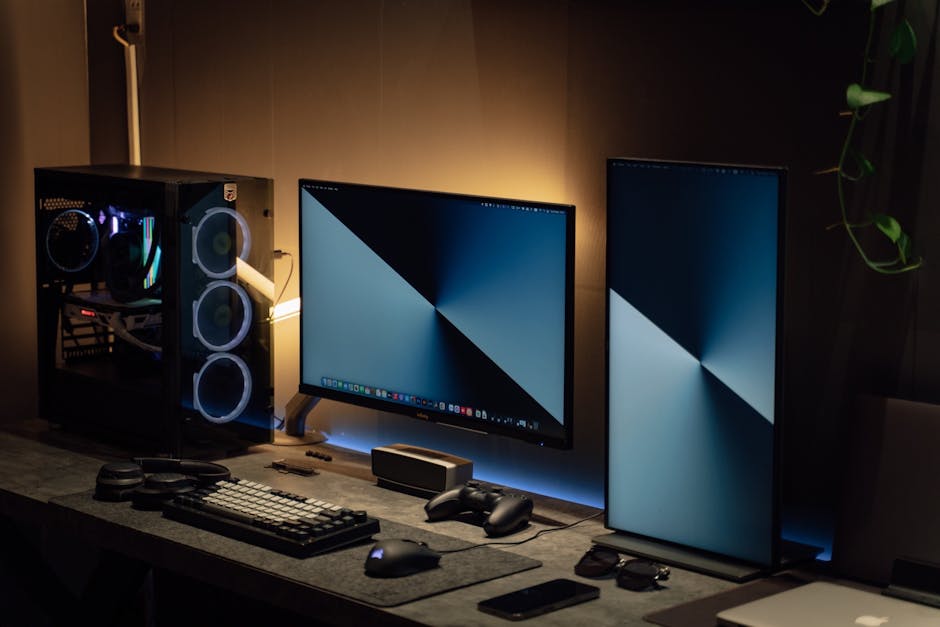 A modern computer setup with gaming accessories and posters in the background.