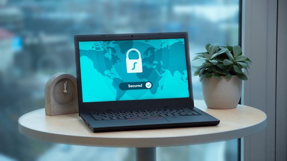 A modern workspace with a laptop and cybersecurity tools in natural light.