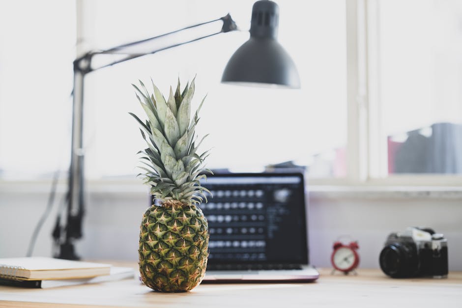 A clean workspace with a laptop and curated products displayed neatly.