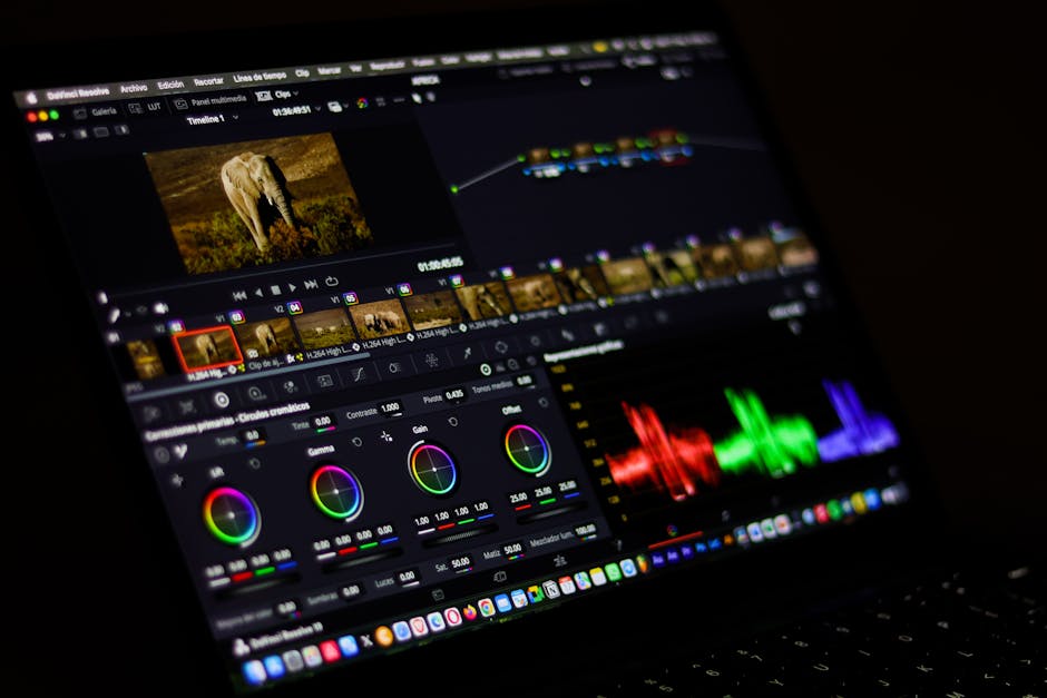 A creative workspace with a laptop, camera, and product displays.