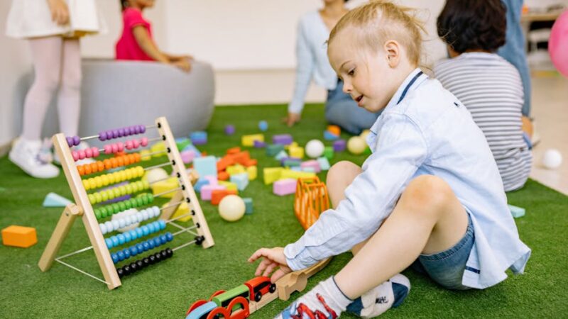 A bright classroom filled with educational tools and game elements.