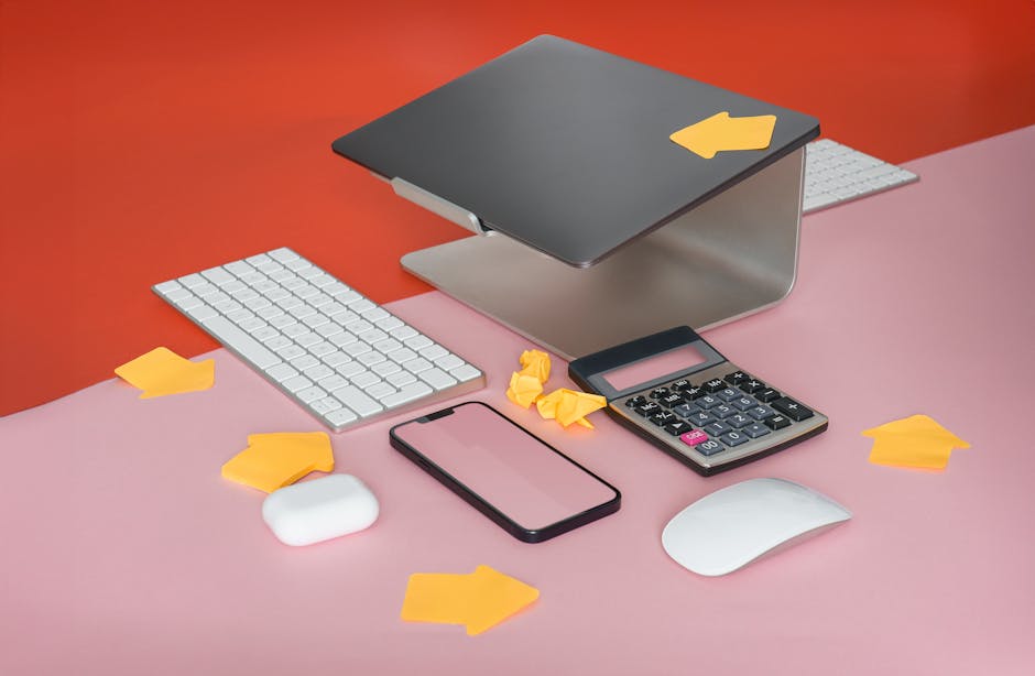 A modern workspace featuring a laptop and tech gadgets in natural light.