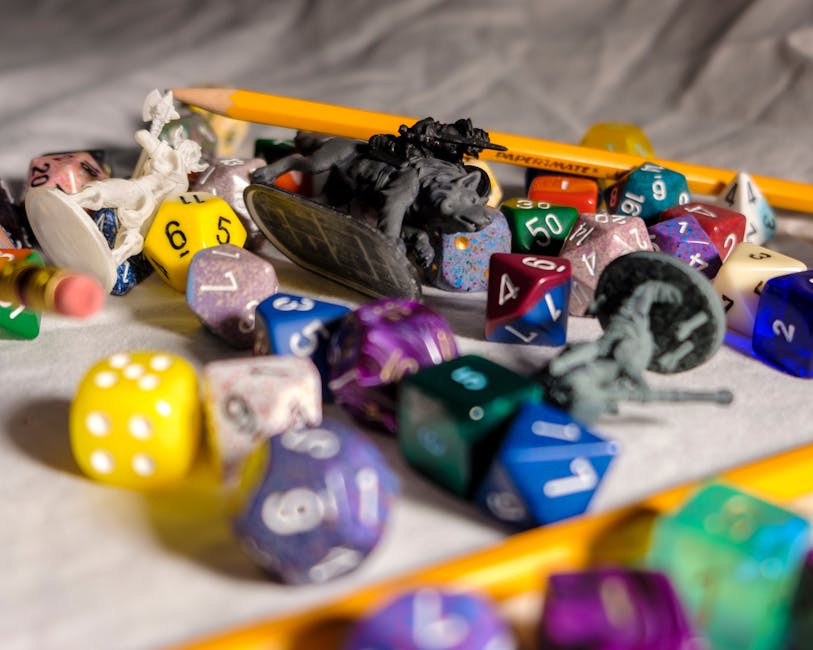 Colorful game elements on a classroom desk with natural light
