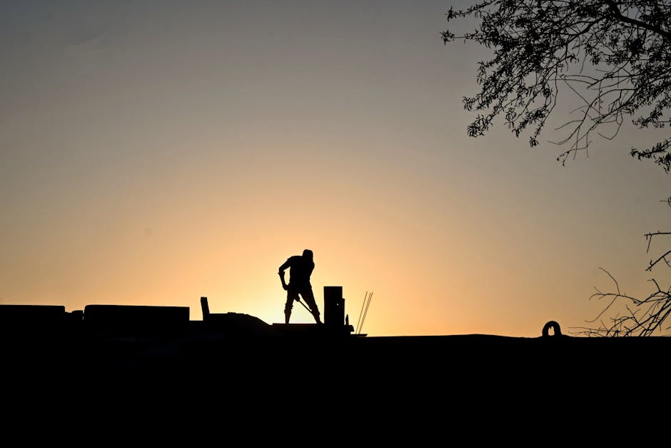 A tranquil construction site with tools and materials at sunrise.