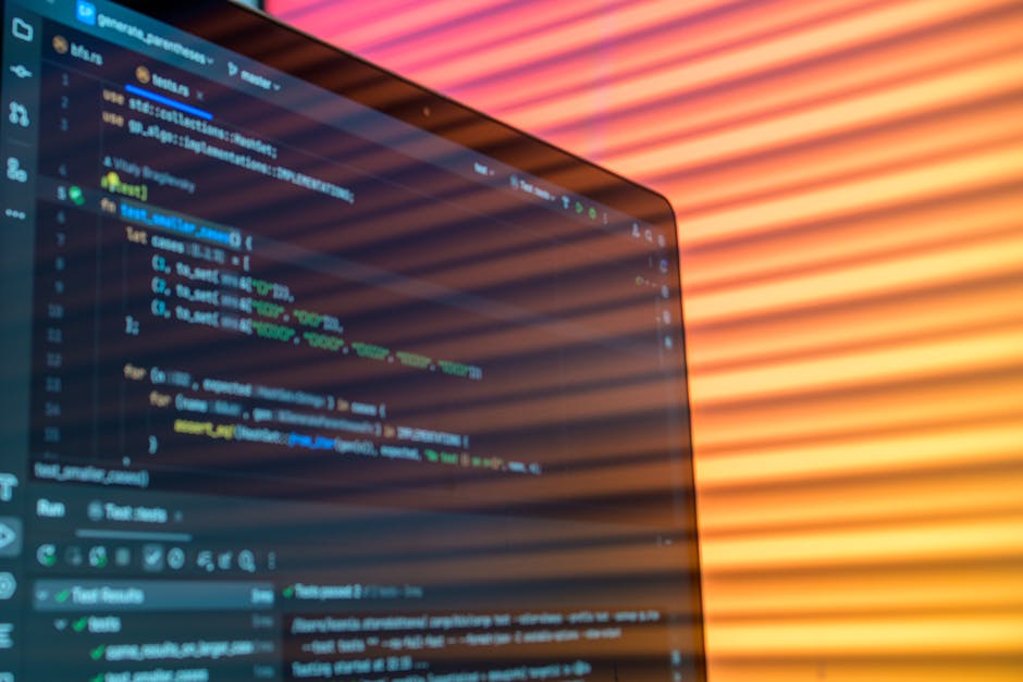 A modern workspace with a laptop and digital graphs in soft light.