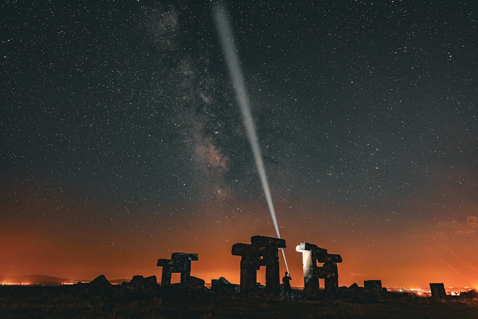 Silhouette of an ancient artifact against a starry night sky.