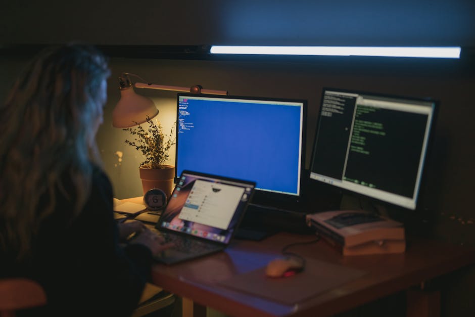A modern workspace with computer screens showing code and analytics.
