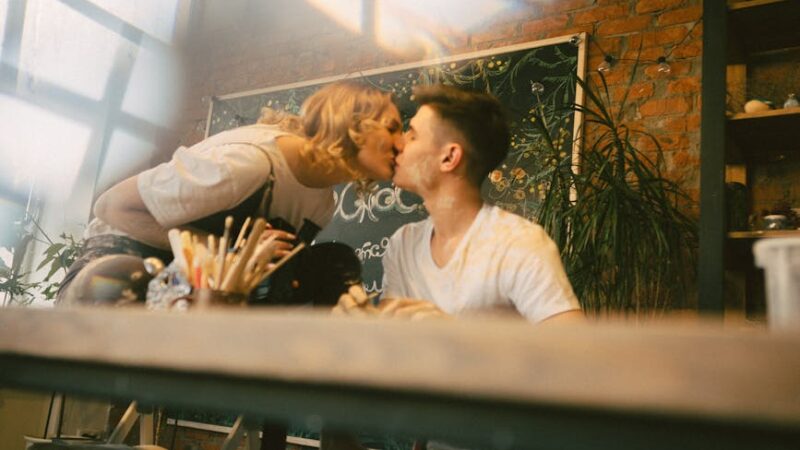 Couple enjoying a shared hobby in a warm, inviting space.