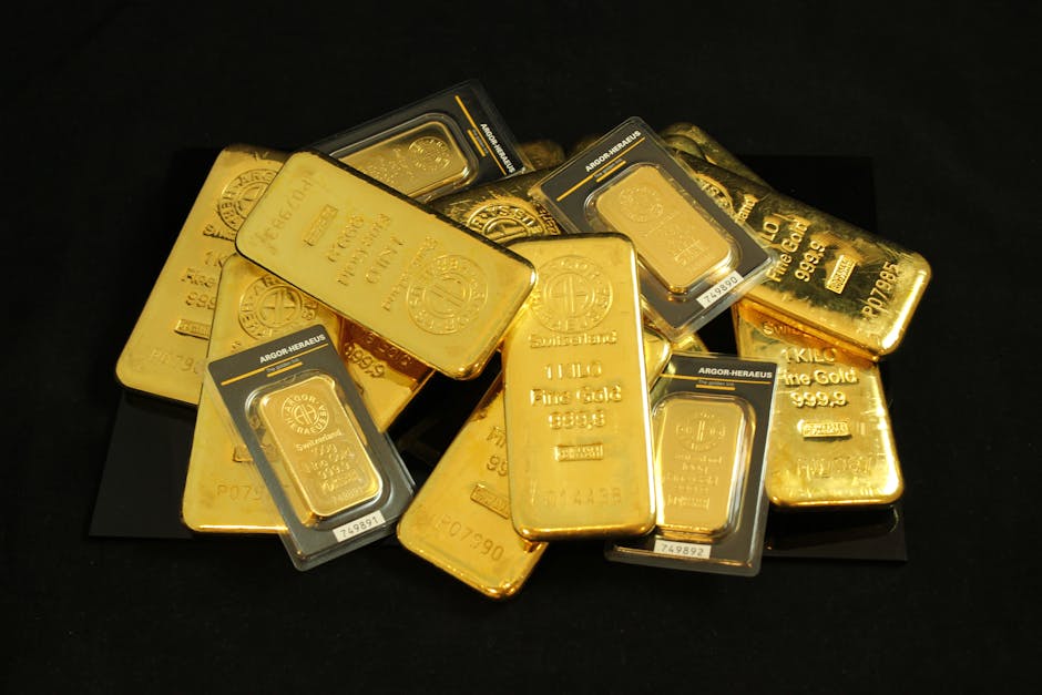 Shimmering gold ingots on a soft velvet surface under warm light