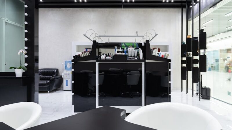 A contemporary hair salon interior with stylish furnishings and soft lighting.