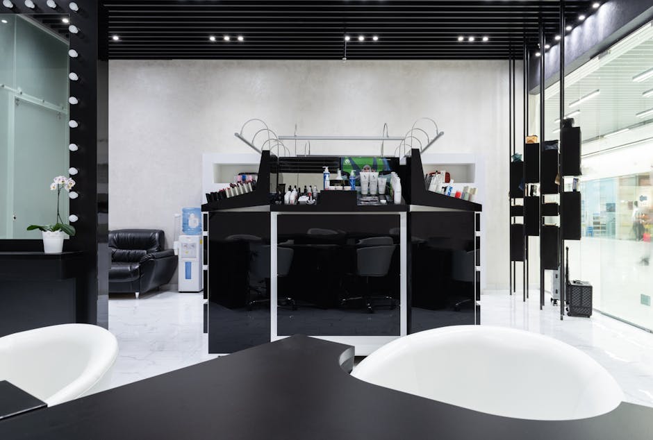 A contemporary hair salon interior with stylish furnishings and soft lighting.