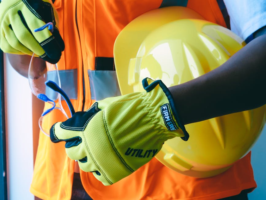 An organized industrial workspace with safety gear on a workbench.