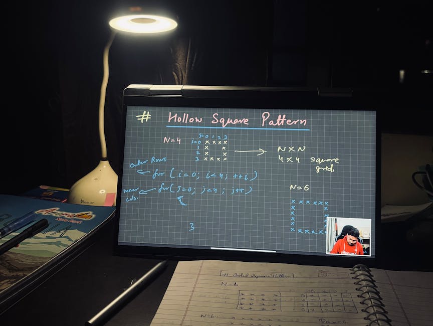 A modern workspace with a laptop and digital tablet for learning