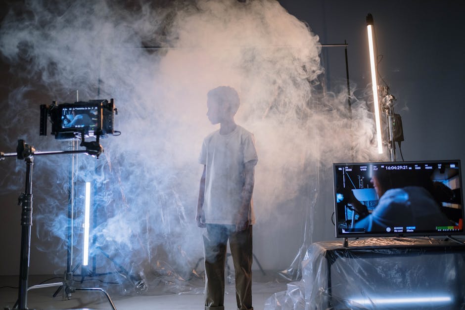 A film set with cameras and animated screens displaying visual effects.