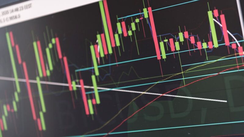 Digital trading screen with fluctuating cryptocurrency graphs and charts