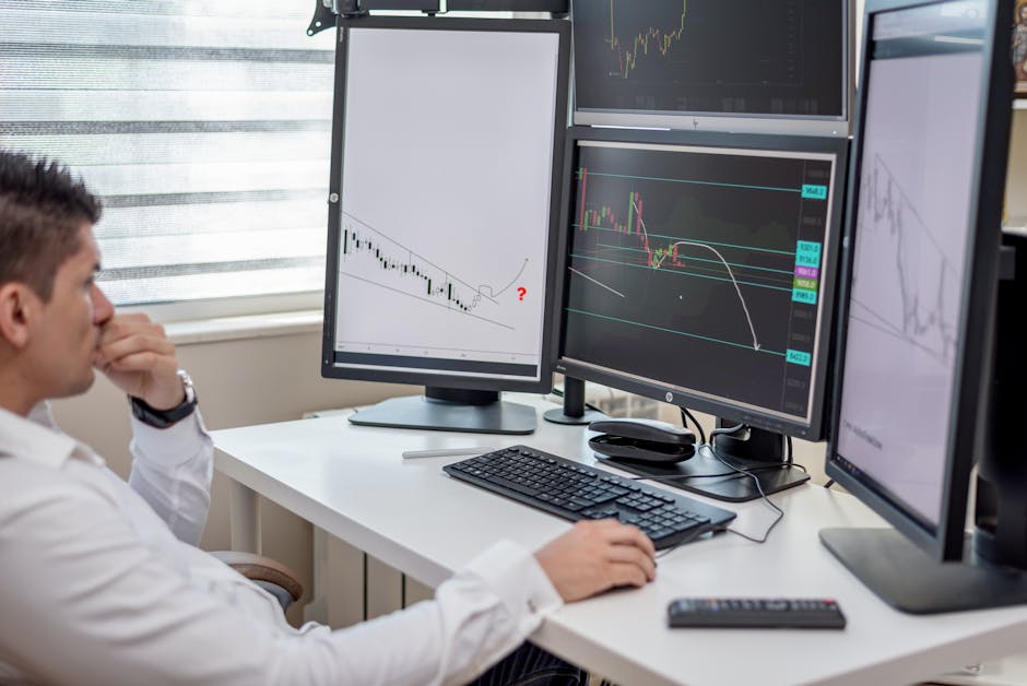 A trading desk with screens showing cryptocurrency market data and charts.