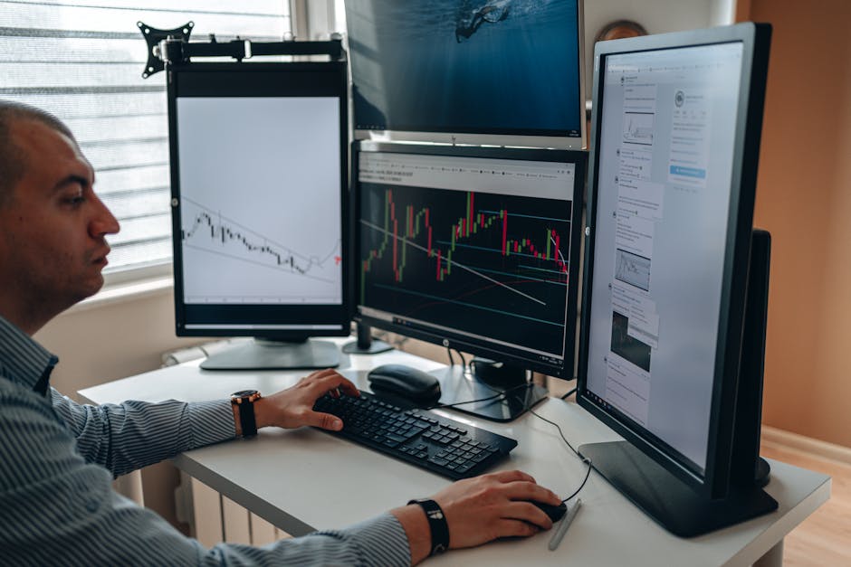 A modern trading desk with screens showing abstract graphs and charts.
